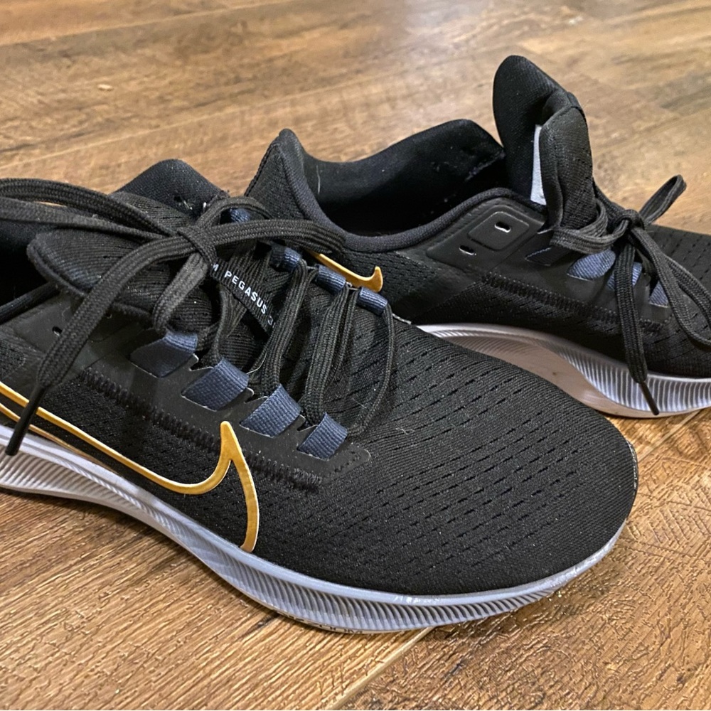 Nike Pegasus black with gold trim. Gently used.